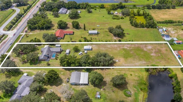 4147 Boggy Creek Rd, Kissimmee, FL 34744 - aerial view of property and surrounding area with a large body of water and property parcel outlined