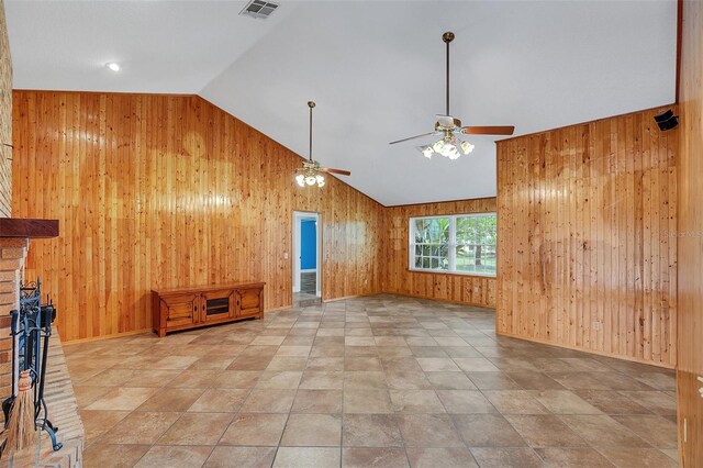 4147 Boggy Creek Rd, Kissimmee, FL 34744 - unfurnished living room with wood walls, ceiling fan, and high vaulted ceiling