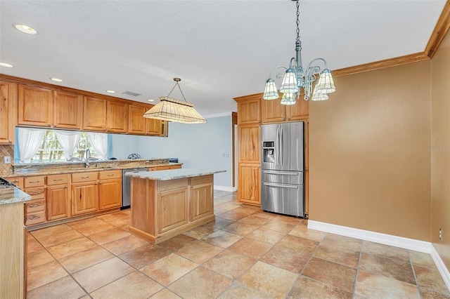 4147 Boggy Creek Rd, Kissimmee, FL 34744 - kitchen featuring appliances with stainless steel finishes, baseboards, recessed lighting, ornamental molding, and light stone countertops