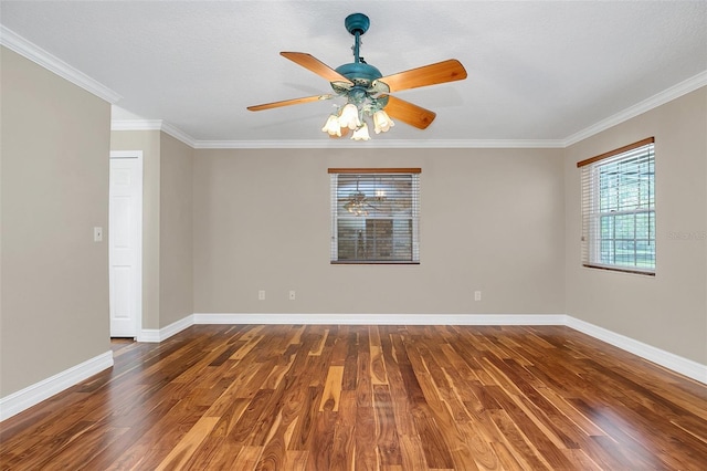 spare room featuring a textured ceiling, dark wood-type flooring, ceiling fan, and ornamental molding