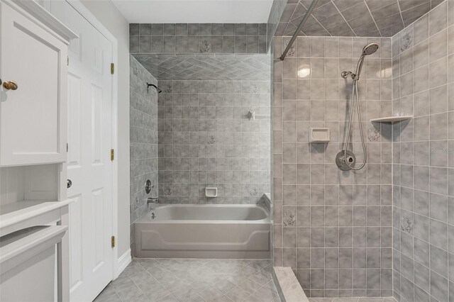 4147 Boggy Creek Rd, Kissimmee, FL 34744 - full bath with tile patterned floors and tiled shower / bath