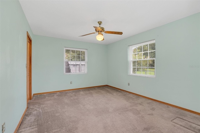 4147 Boggy Creek Rd, Kissimmee, FL 34744 - carpeted empty room with plenty of natural light, baseboards, and ceiling fan