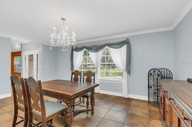 dining space featuring ornamental molding and an inviting chandelier