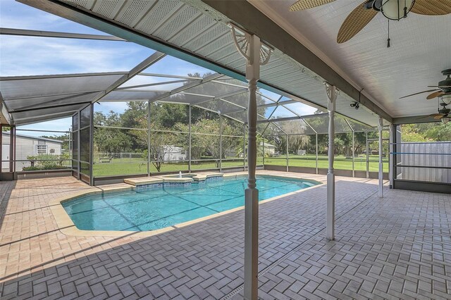 4147 Boggy Creek Rd, Kissimmee, FL 34744 - view of pool featuring ceiling fan, a patio, a pool with connected hot tub, and a lanai