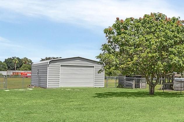 4147 Boggy Creek Rd, Kissimmee, FL 34744 - view of detached garage
