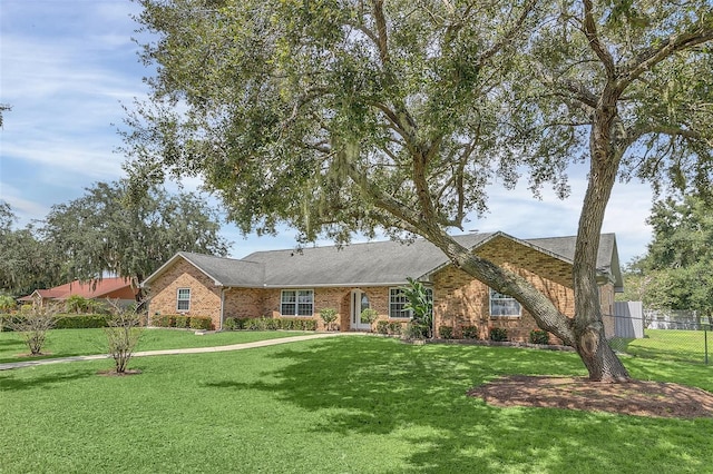 ranch-style house with a front yard