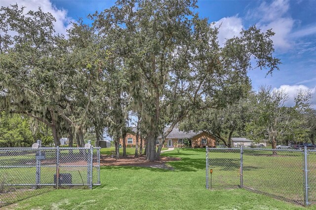 4147 Boggy Creek Rd, Kissimmee, FL 34744 - view of yard featuring a gate