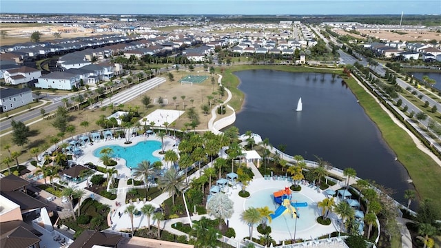 bird's eye view with a residential view and a water view