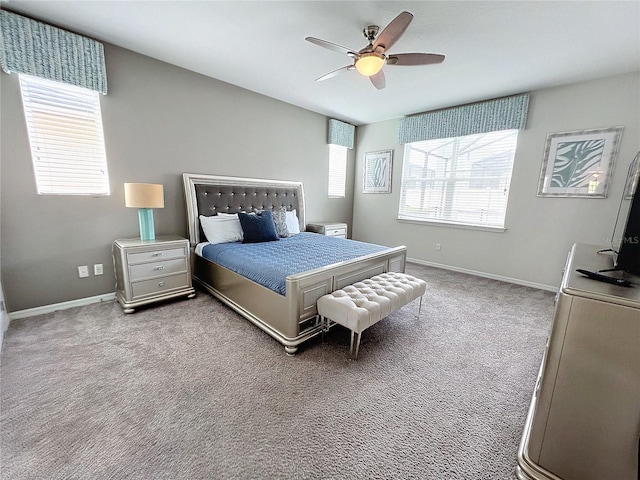 carpeted bedroom featuring ceiling fan and baseboards