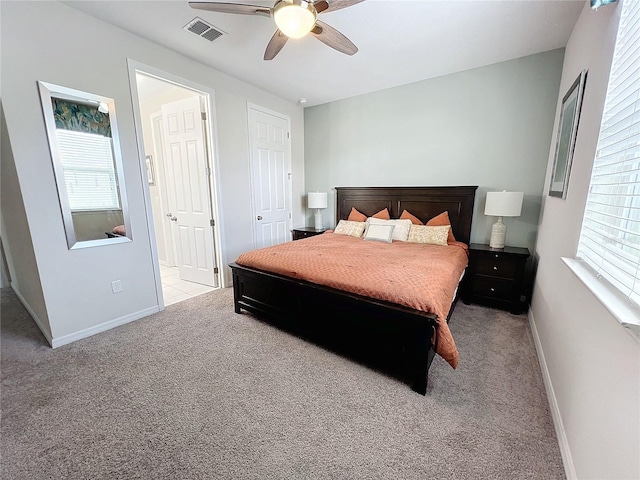 carpeted bedroom with multiple windows, baseboards, and visible vents