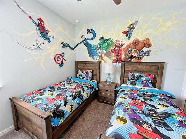 carpeted bedroom featuring baseboards and a textured ceiling