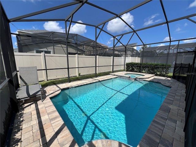 view of pool featuring a fenced in pool, a patio, an in ground hot tub, and a lanai