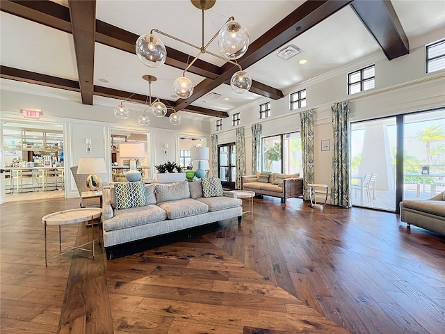 living area with hardwood / wood-style flooring, visible vents, coffered ceiling, and beam ceiling