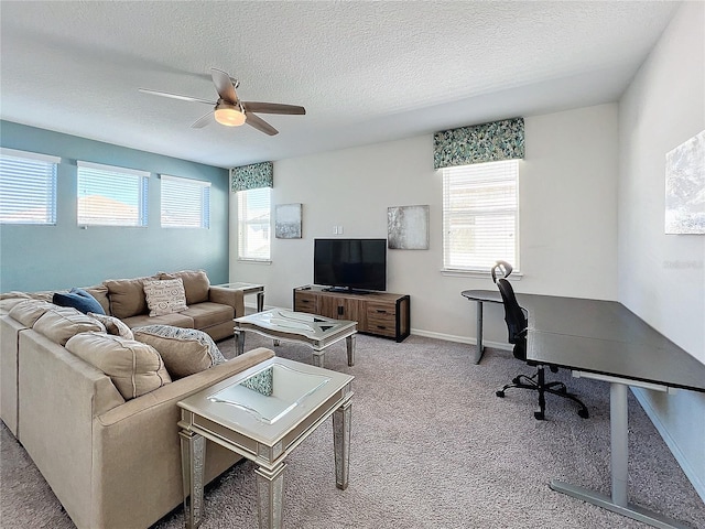 living room featuring a wealth of natural light, carpet floors, and a textured ceiling