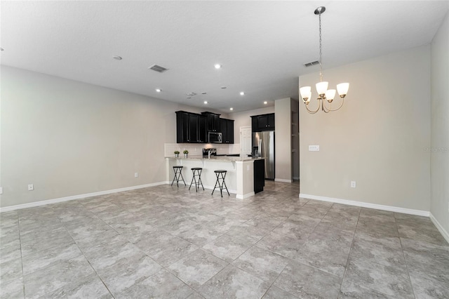 unfurnished living room featuring a textured ceiling and a notable chandelier