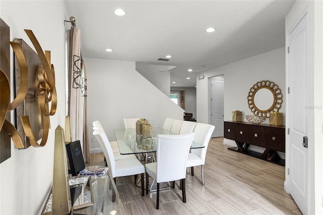 dining space featuring light wood-type flooring