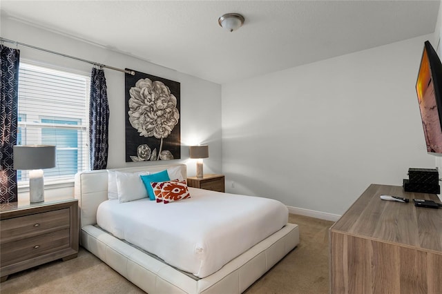 bedroom featuring light colored carpet