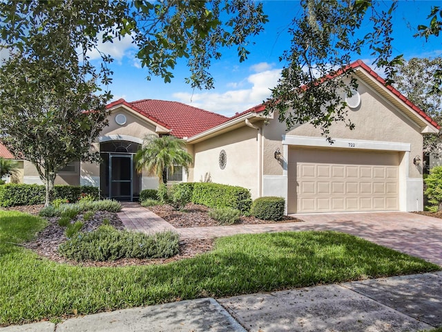 mediterranean / spanish-style home with a garage