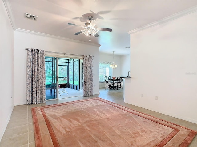 tiled spare room featuring ceiling fan with notable chandelier and crown molding