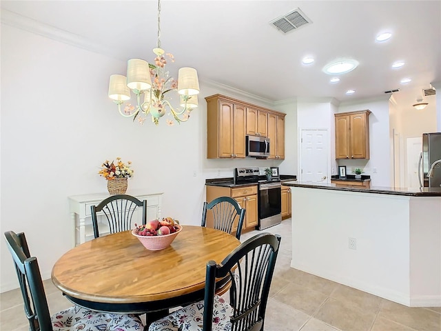 kitchen with pendant lighting, light tile patterned flooring, appliances with stainless steel finishes, an inviting chandelier, and crown molding