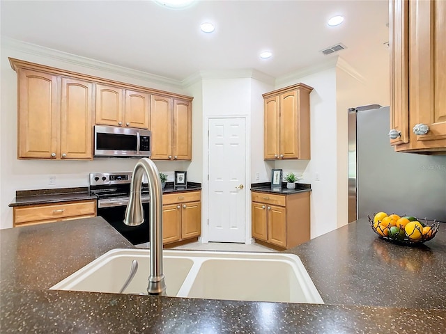 kitchen featuring stainless steel appliances, sink, and crown molding