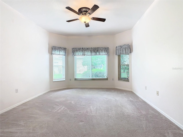 unfurnished room with light carpet and ceiling fan