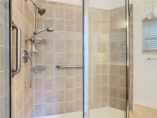 bathroom featuring a shower with shower door