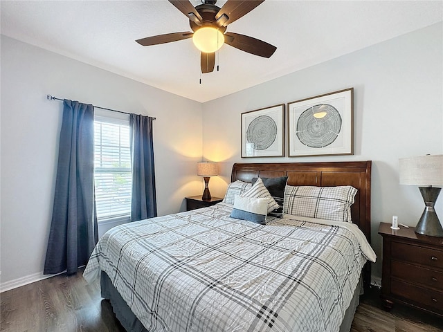 bedroom with dark wood-type flooring and ceiling fan