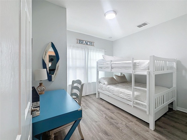 bedroom featuring wood-type flooring