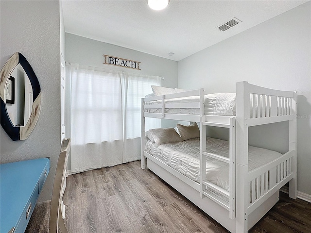 bedroom with hardwood / wood-style floors