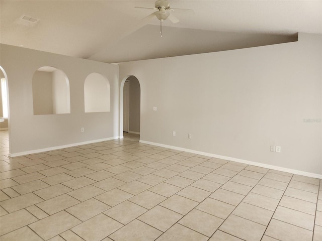 tiled empty room featuring ceiling fan and vaulted ceiling