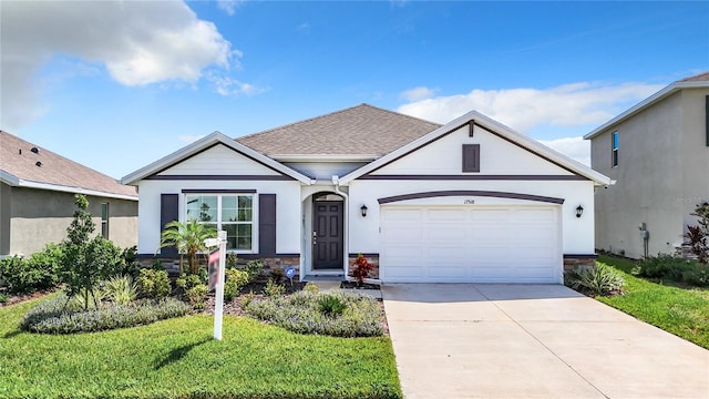 view of front of house with a garage and a front lawn