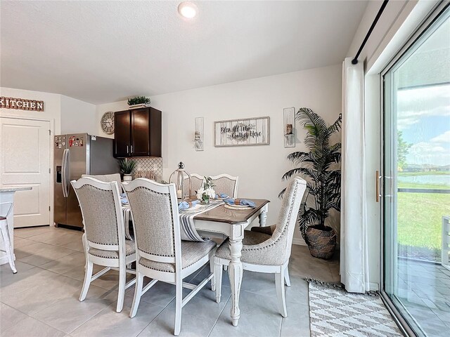 dining room featuring light tile patterned flooring