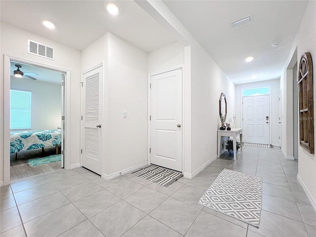 hallway with light tile patterned flooring