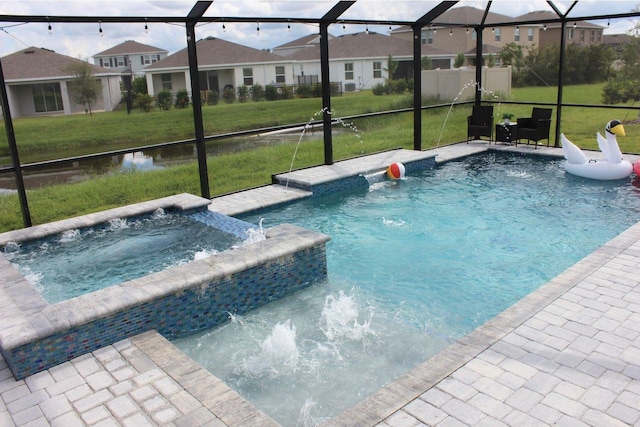 view of swimming pool featuring an in ground hot tub, pool water feature, and a lawn