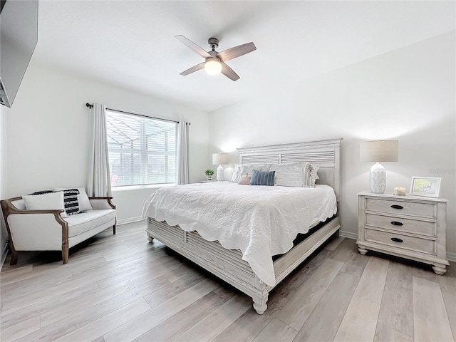 bedroom featuring light hardwood / wood-style floors and ceiling fan