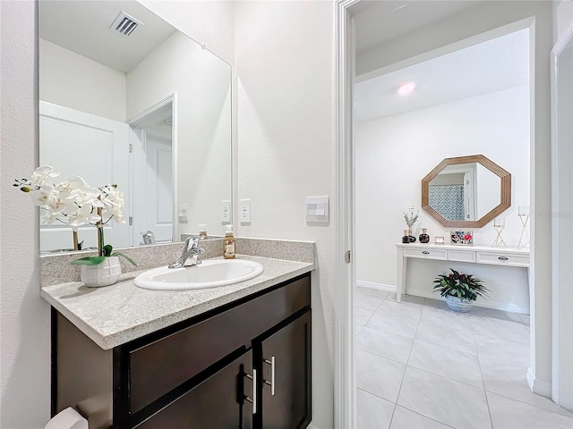bathroom featuring visible vents, tile patterned flooring, and vanity