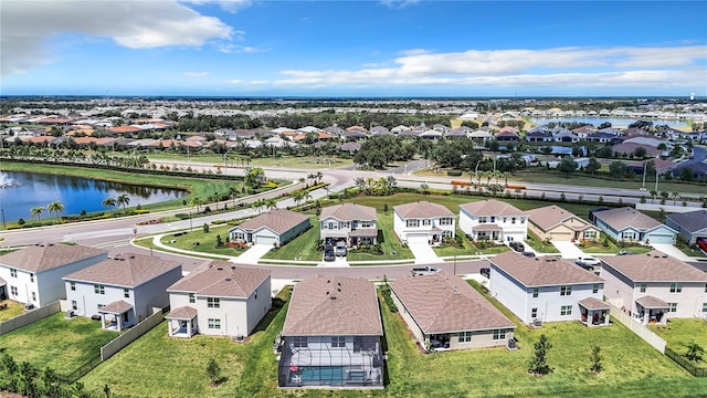 bird's eye view with a residential view and a water view