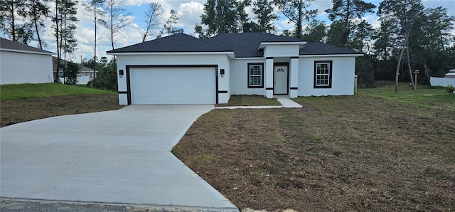 view of front of home featuring a garage and a front lawn