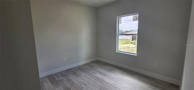 spare room with light wood-type flooring