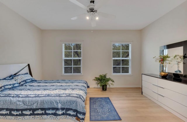 bedroom featuring light wood-type flooring and ceiling fan