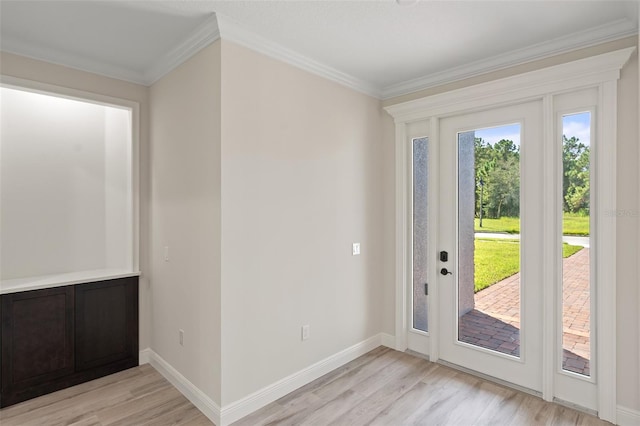 doorway featuring light wood-type flooring and crown molding