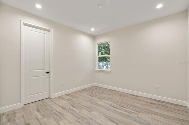 unfurnished room featuring light wood-type flooring