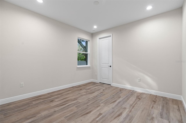 spare room featuring light wood-type flooring