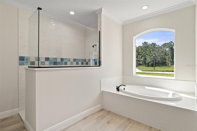 bathroom with independent shower and bath, hardwood / wood-style floors, and crown molding