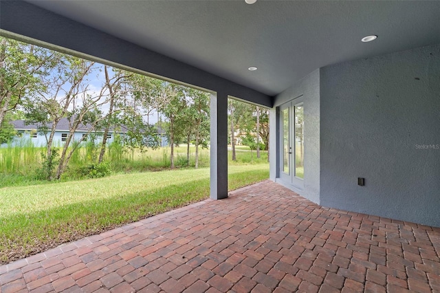 view of patio featuring a water view