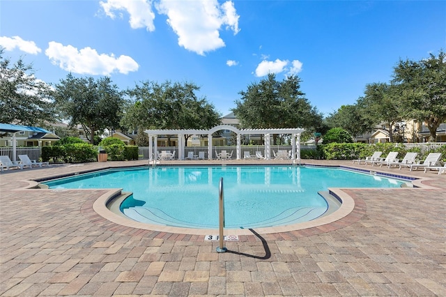 view of pool featuring a pergola and a patio