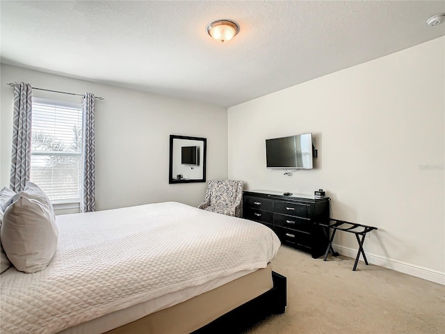 carpeted bedroom with a textured ceiling