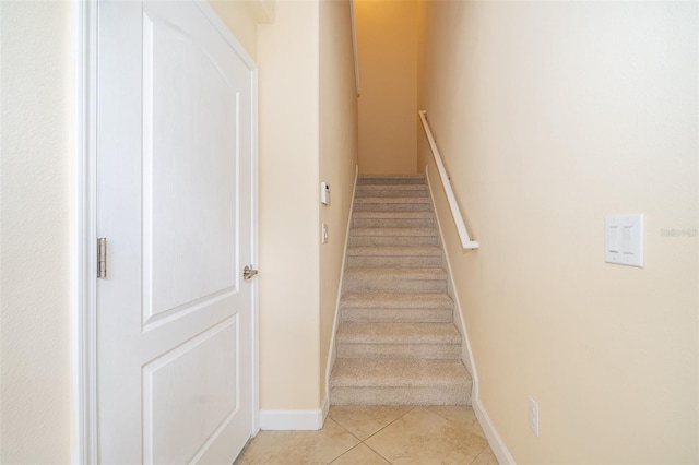 staircase with tile patterned floors