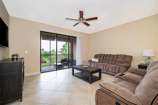 tiled living room with ceiling fan